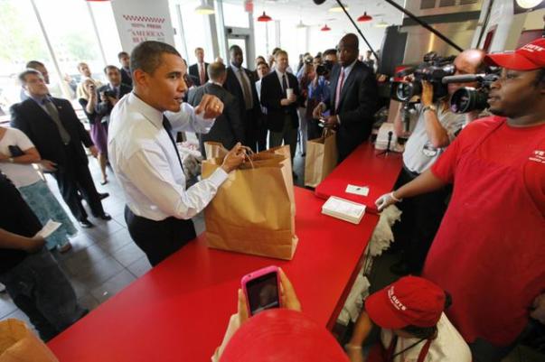 Barack Obama orders hamburgers at Five Guys on 5/29/09 - AP Photo/Gerald Herbert